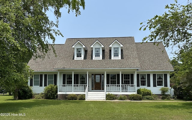 116 Spencer Ln, Newport, NC 28570 - cape cod home featuring a front lawn, covered porch, and a shingled roof