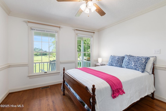 116 Spencer Ln, Newport, NC 28570 - bedroom featuring wood finished floors, ornamental molding, ceiling fan, and a textured ceiling