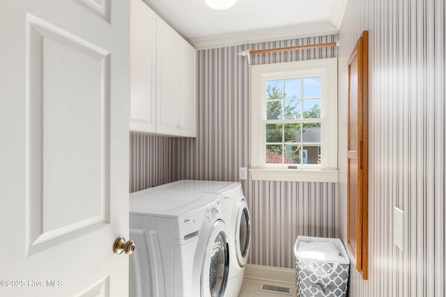 116 Spencer Ln, Newport, NC 28570 - laundry room with wallpapered walls, independent washer and dryer, and cabinet space