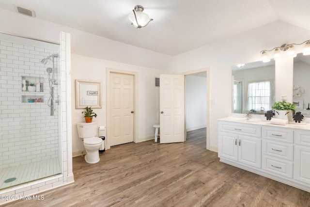 116 Spencer Ln, Newport, NC 28570 - bathroom with a shower stall, double vanity, wood finished floors, and vaulted ceiling