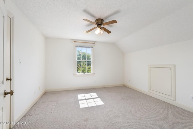 116 Spencer Ln, Newport, NC 28570 - bonus room featuring a ceiling fan, light carpet, lofted ceiling, and a textured ceiling