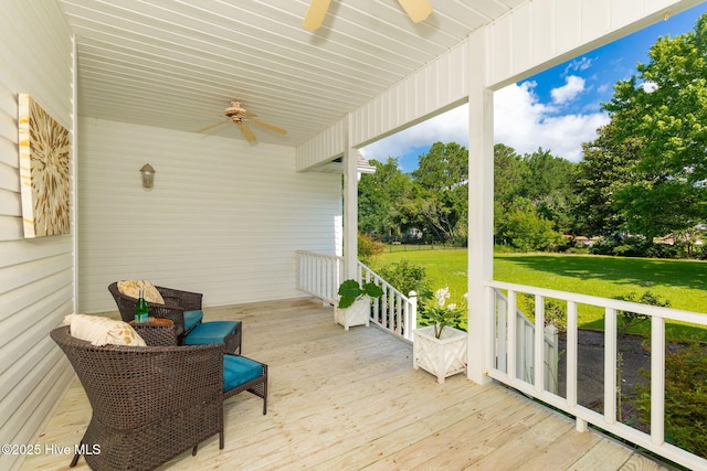 116 Spencer Ln, Newport, NC 28570 - wooden porch featuring a ceiling fan and a yard