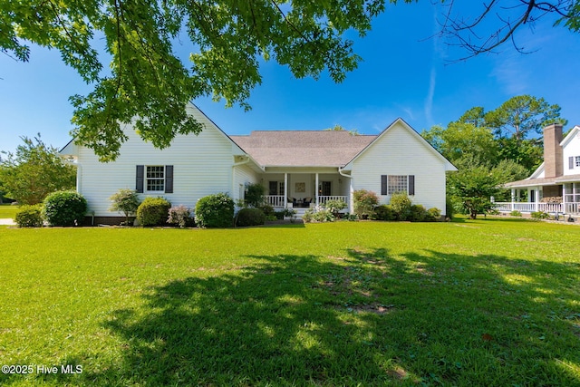 116 Spencer Ln, Newport, NC 28570 - view of front of house featuring covered porch and a front yard