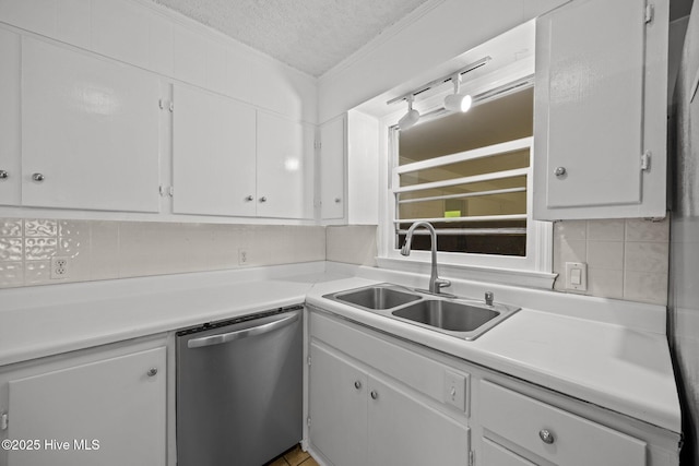 2411 Grace Ave, New Bern, NC 28562 - kitchen featuring stainless steel dishwasher, a sink, a textured ceiling, tasteful backsplash, and white cabinets