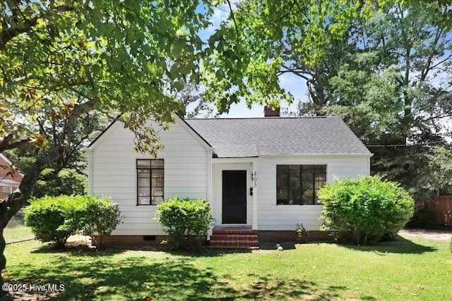 403 S Andrews Ave, Goldsboro, NC 27530 - view of front of home with a front yard, roof with shingles, a chimney, and entry steps