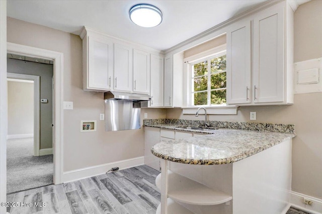 403 S Andrews Ave, Goldsboro, NC 27530 - kitchen with a sink, open shelves, light stone countertops, and white cabinetry