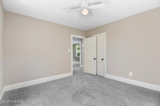 403 S Andrews Ave, Goldsboro, NC 27530 - empty room with carpet floors, baseboards, and a ceiling fan