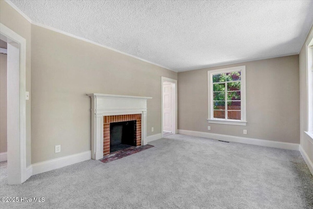 403 S Andrews Ave, Goldsboro, NC 27530 - unfurnished living room featuring a textured ceiling, carpet flooring, crown molding, a brick fireplace, and baseboards
