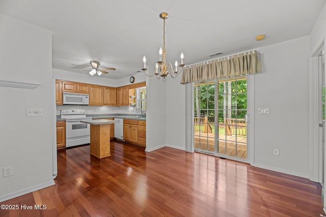 309 Belle Oaks Dr, New Bern, NC 28562 - kitchen with white appliances, dark wood-style flooring, a chandelier, and light countertops