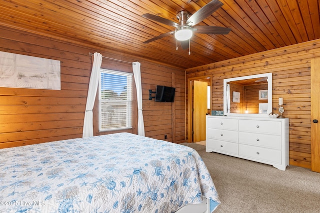 103 NE 17th St, Oak Island, NC 28465 - bedroom featuring carpet flooring, wood walls, a ceiling fan, and wooden ceiling