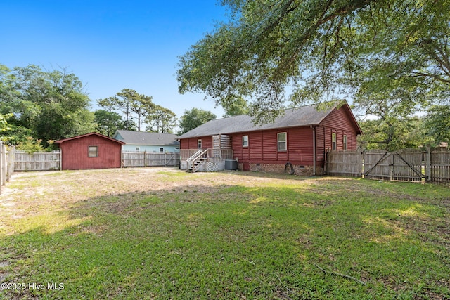 103 NE 17th St, Oak Island, NC 28465 - rear view of property featuring central air condition unit and crawl space
