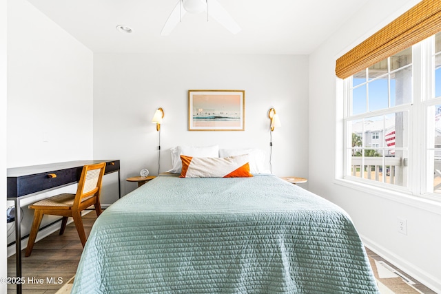 271 E Second St, Ocean Isle Beach, NC 28469 - bedroom featuring wood finished floors, ceiling fan, and baseboards