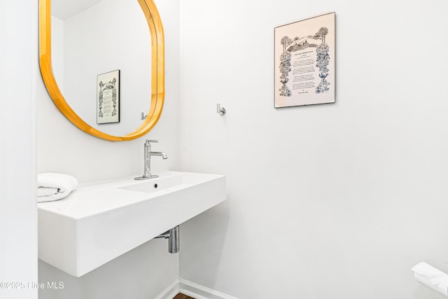 271 E Second St, Ocean Isle Beach, NC 28469 - bathroom featuring baseboards