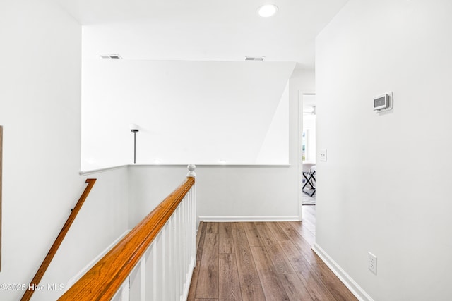 271 E Second St, Ocean Isle Beach, NC 28469 - hallway featuring wood finished floors, an upstairs landing, recessed lighting, and baseboards