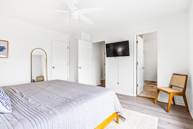 271 E Second St, Ocean Isle Beach, NC 28469 - bedroom featuring light wood-type flooring, baseboards, and ceiling fan