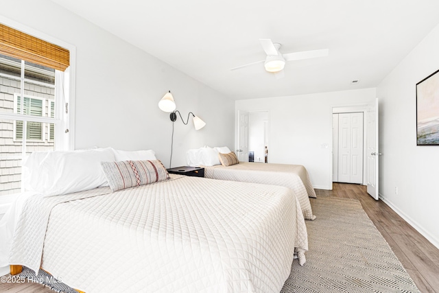 271 E Second St, Ocean Isle Beach, NC 28469 - bedroom featuring wood finished floors, baseboards, and a ceiling fan