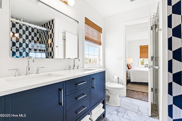 271 E Second St, Ocean Isle Beach, NC 28469 - ensuite bathroom featuring marble finish floors, double vanity, toilet, and a shower with door