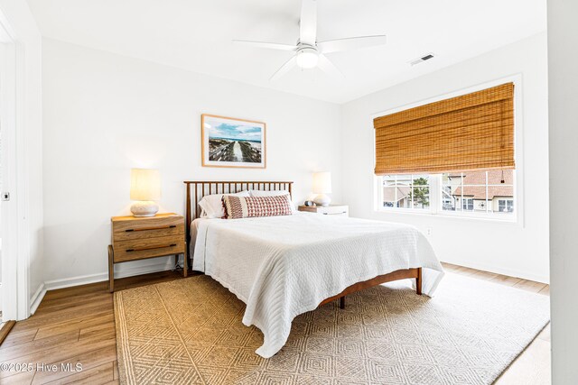271 E Second St, Ocean Isle Beach, NC 28469 - bedroom with wood finished floors, baseboards, and ceiling fan