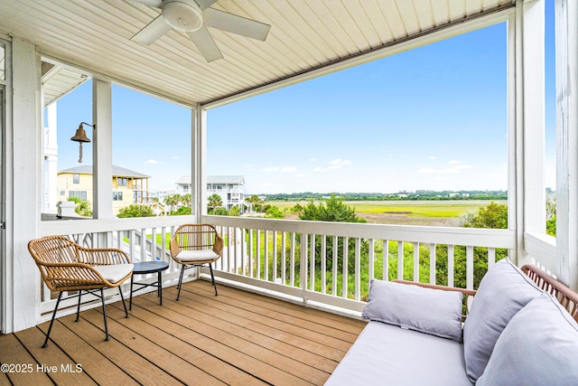 271 E Second St, Ocean Isle Beach, NC 28469 - wooden terrace with a ceiling fan