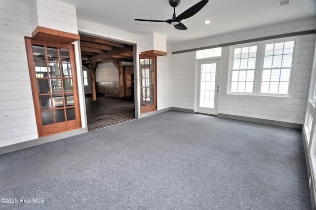 9265 W Lake Rd, Calabash, NC 28467 - spare room with a ceiling fan, wooden walls, and recessed lighting