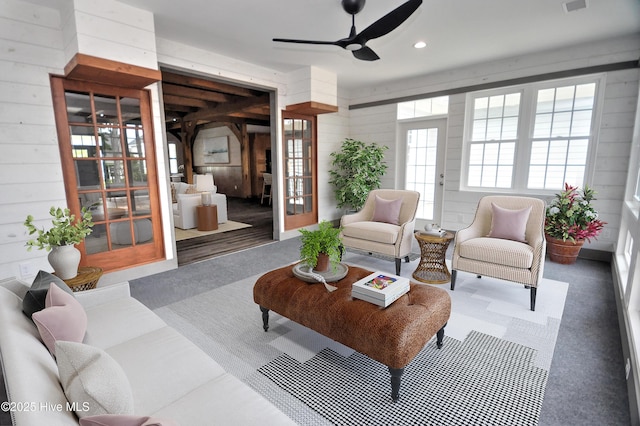 9265 W Lake Rd, Calabash, NC 28467 - living room with ceiling fan, wood walls, and recessed lighting