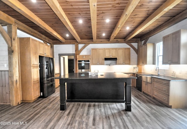 9265 W Lake Rd, Calabash, NC 28467 - kitchen featuring black appliances, dark countertops, wood ceiling with exposed beams, a sink, and wood finished floors