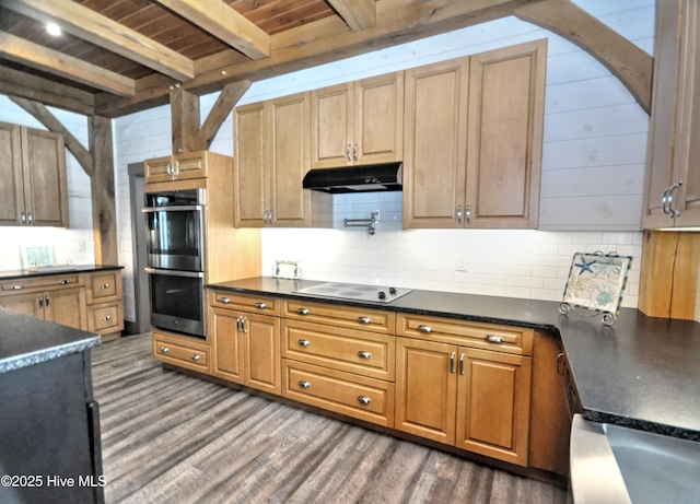 9265 W Lake Rd, Calabash, NC 28467 - kitchen featuring double oven, under cabinet range hood, dark countertops, electric stovetop, and wooden ceiling with exposed beams