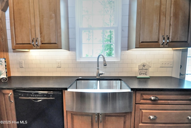 9265 W Lake Rd, Calabash, NC 28467 - kitchen with black dishwasher, a sink, dark countertops, and backsplash