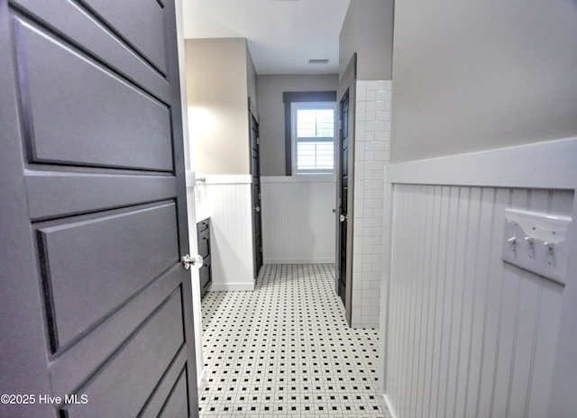 9265 W Lake Rd, Calabash, NC 28467 - bathroom featuring a wainscoted wall and vanity
