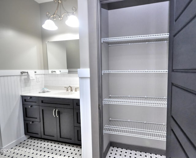 9265 W Lake Rd, Calabash, NC 28467 - bathroom with vanity, tasteful backsplash, and baseboards