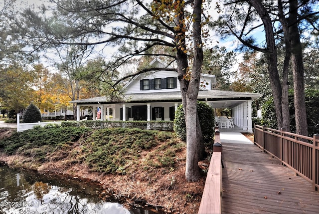 9265 W Lake Rd, Calabash, NC 28467 - rear view of property with covered porch