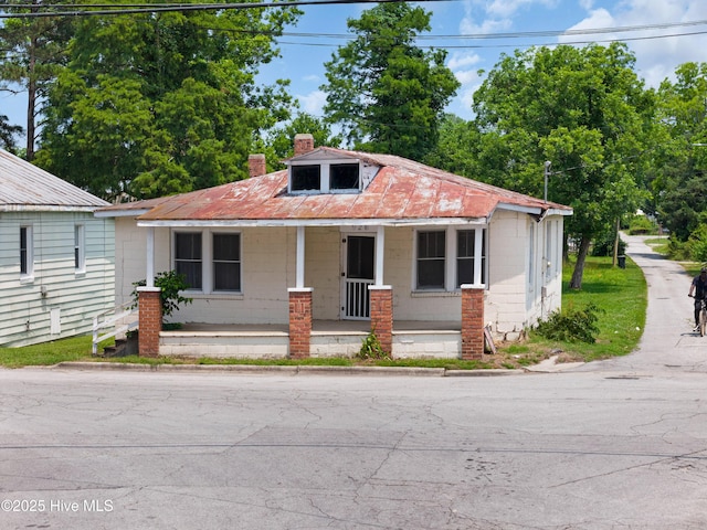 926 Cedar St, New Bern, NC 28560 - bungalow with covered porch, concrete block siding, and a chimney