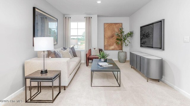 2025 Minnette Cir, New Bern, NC 28562 - living room featuring baseboards and light colored carpet
