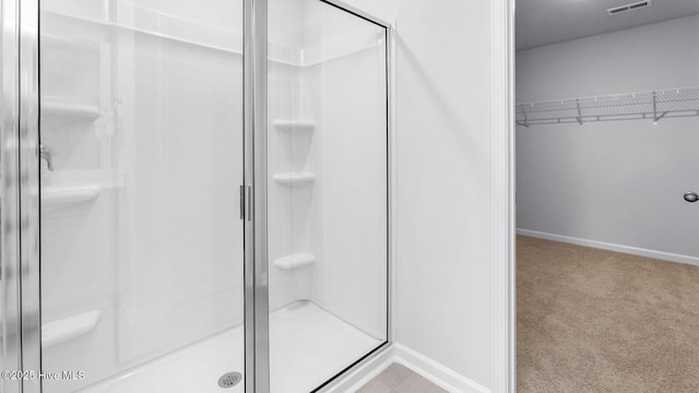 2031 Minnette Cir, New Bern, NC 28562 - full bath with a stall shower, a spacious closet, and baseboards