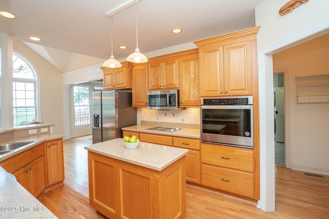 3399 Channelside Dr SW, Supply, NC 28462 - kitchen featuring stainless steel appliances, tasteful backsplash, light wood finished floors, recessed lighting, and a kitchen island