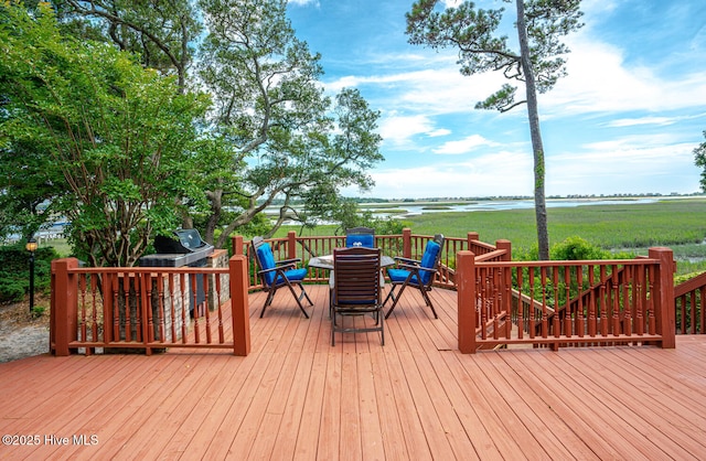 3399 Channelside Dr SW, Supply, NC 28462 - wooden terrace featuring outdoor dining space and a water view