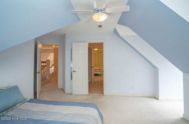 3399 Channelside Dr SW, Supply, NC 28462 - carpeted bedroom featuring baseboards, ceiling fan, and vaulted ceiling