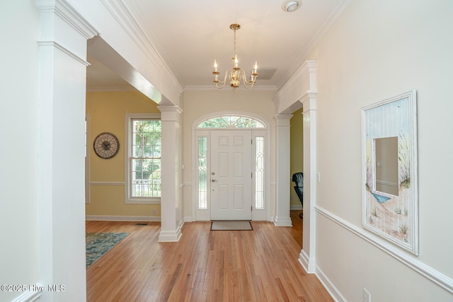 3399 Channelside Dr SW, Supply, NC 28462 - entryway with light wood-style flooring, plenty of natural light, a chandelier, baseboards, and ornamental molding