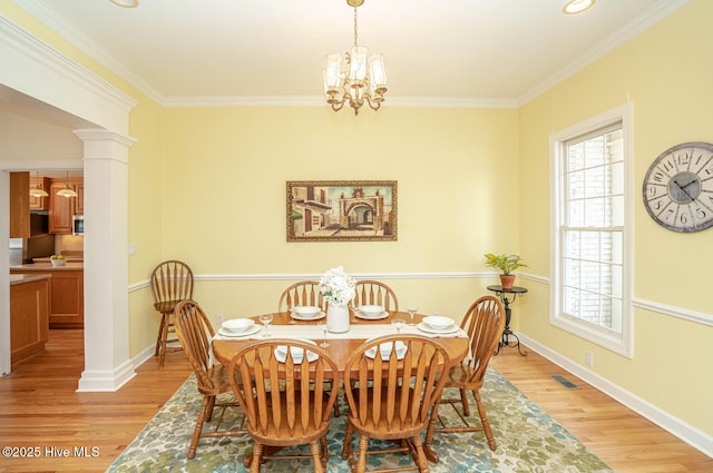 3399 Channelside Dr SW, Supply, NC 28462 - dining space featuring healthy amount of natural light, light wood-style flooring, ornamental molding, a chandelier, and baseboards