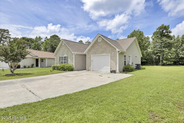 111 Bay Tree Cir, Hampstead, NC 28443 - single story home with central AC unit, an attached garage, concrete driveway, and a front lawn