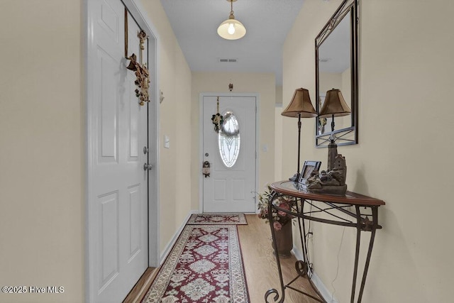 111 Bay Tree Cir, Hampstead, NC 28443 - entryway featuring light wood-style floors and baseboards