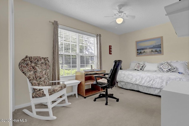 111 Bay Tree Cir, Hampstead, NC 28443 - bedroom with carpet flooring, multiple windows, an office area, a textured ceiling, and ceiling fan