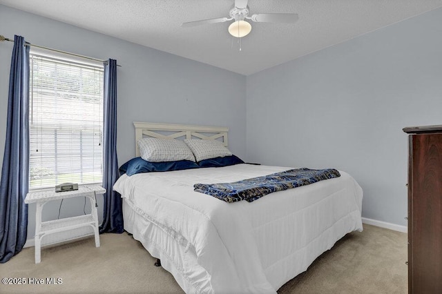 111 Bay Tree Cir, Hampstead, NC 28443 - bedroom with light colored carpet, baseboards, ceiling fan, and a textured ceiling