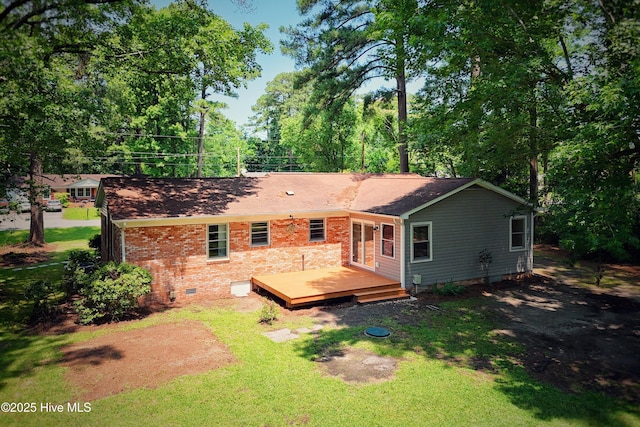 429 Swiss Rd, New Bern, NC 28560 - rear view of house featuring crawl space, a deck, brick siding, and a shingled roof