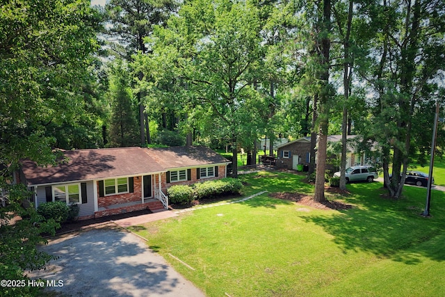429 Swiss Rd, New Bern, NC 28560 - ranch-style home featuring brick siding and a front lawn