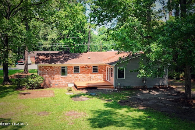 429 Swiss Rd, New Bern, NC 28560 - back of property with a wooden deck, a yard, brick siding, and crawl space