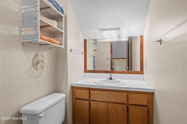 241 Moonlight Dr, Atlantic Beach, NC 28512 - half bath featuring toilet, vanity, and a textured ceiling