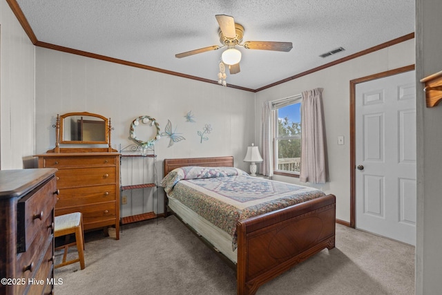 241 Moonlight Dr, Atlantic Beach, NC 28512 - carpeted bedroom with ornamental molding, a textured ceiling, a ceiling fan, and baseboards