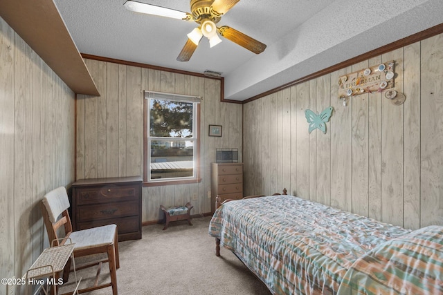 241 Moonlight Dr, Atlantic Beach, NC 28512 - carpeted bedroom with wooden walls and a ceiling fan
