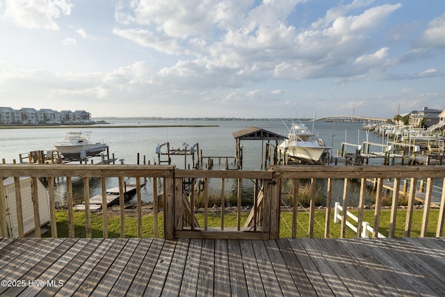 241 Moonlight Dr, Atlantic Beach, NC 28512 - wooden terrace with boat lift, a boat dock, and a water view